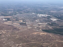 2022-03-24 20 17 50 UTC minus 7 View north from an airplane towards the city of Tracy in San Joaquin County, California